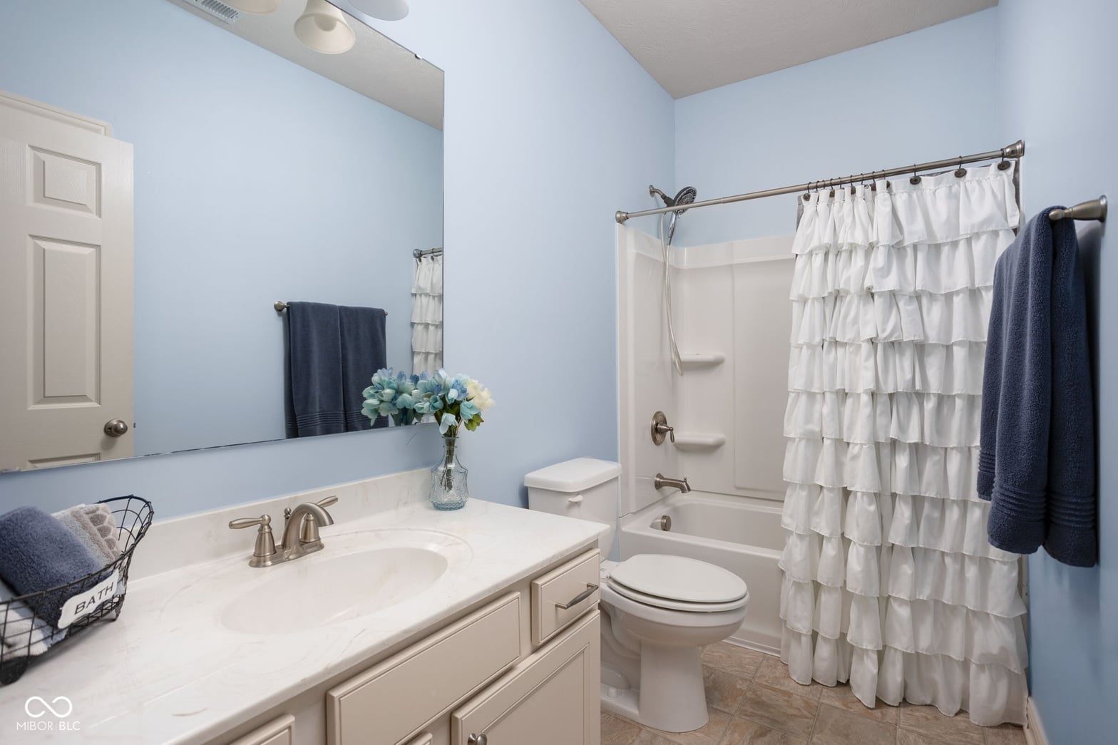 Bright, clean primary bathroom with updated fixtures and finishes.