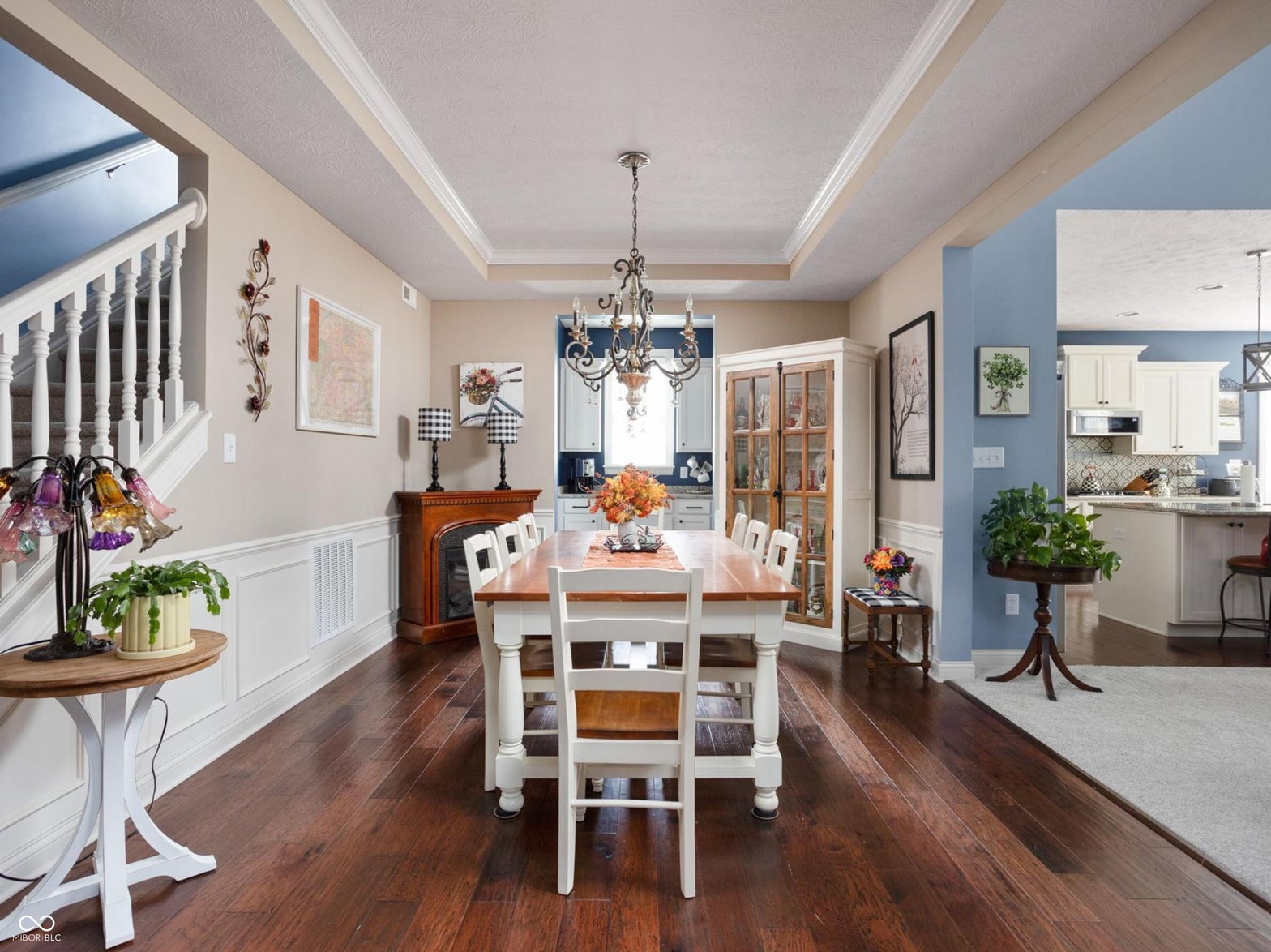 Elegant dining space with coffered ceilings and hardwood floors.