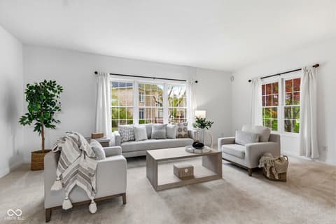 Living room at 13867 Smokey Ridge Drive, Carmel, IN — Bright, airy living room with abundant natural light.