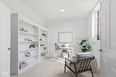 Home office at 13867 Smokey Ridge Drive, Carmel, IN — Bright, modern home office with custom built-in shelving.
