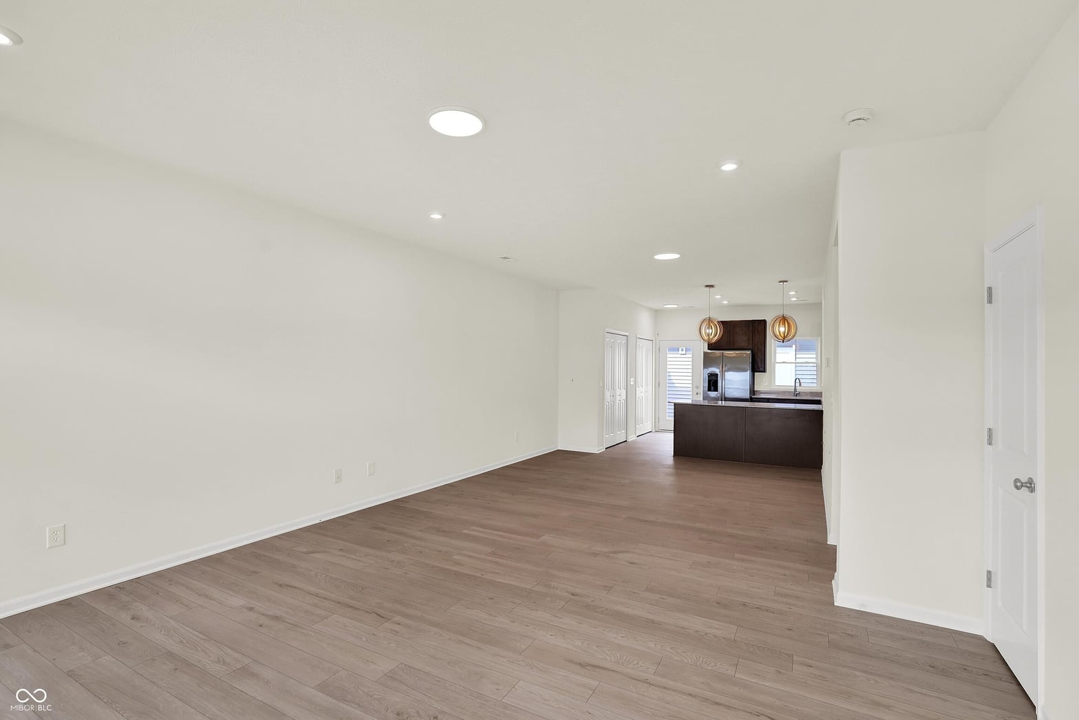 Bright open living area flows seamlessly into modern kitchen