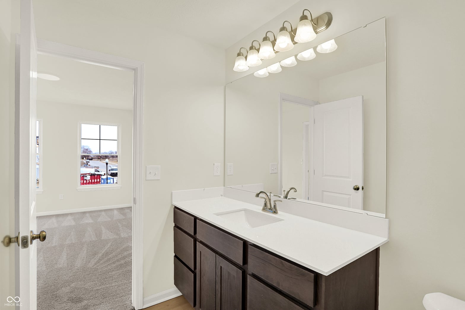 Bright, updated primary bathroom with modern vanity.