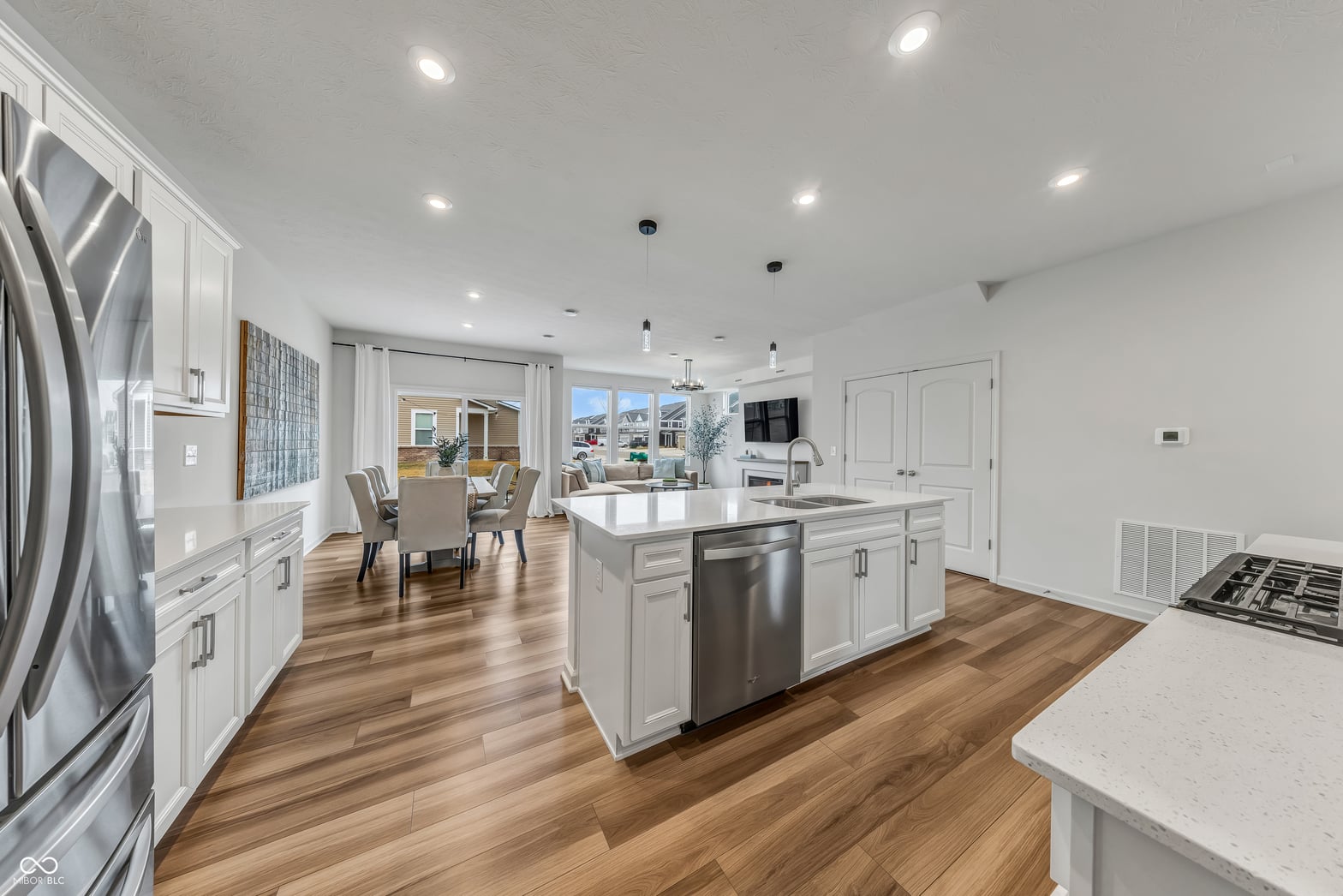 Modern kitchen with island, premium appliances, and open layout.
