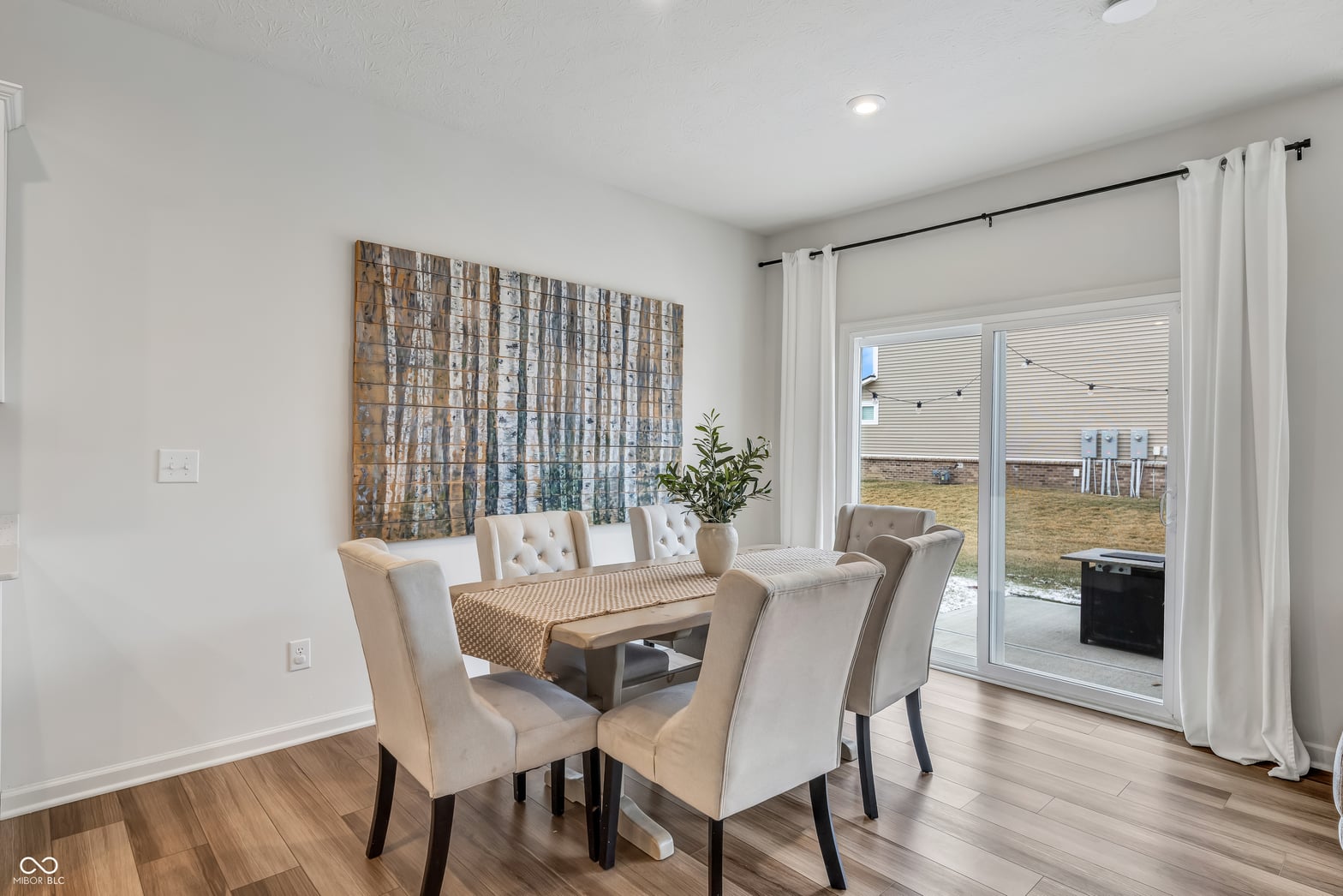 Bright dining area with patio access and modern finishes.