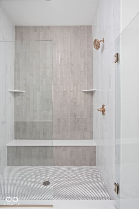 Primary bathroom at 17338 Ditch Road, Westfield, IN — Luxurious walk-in shower with premium finishes.