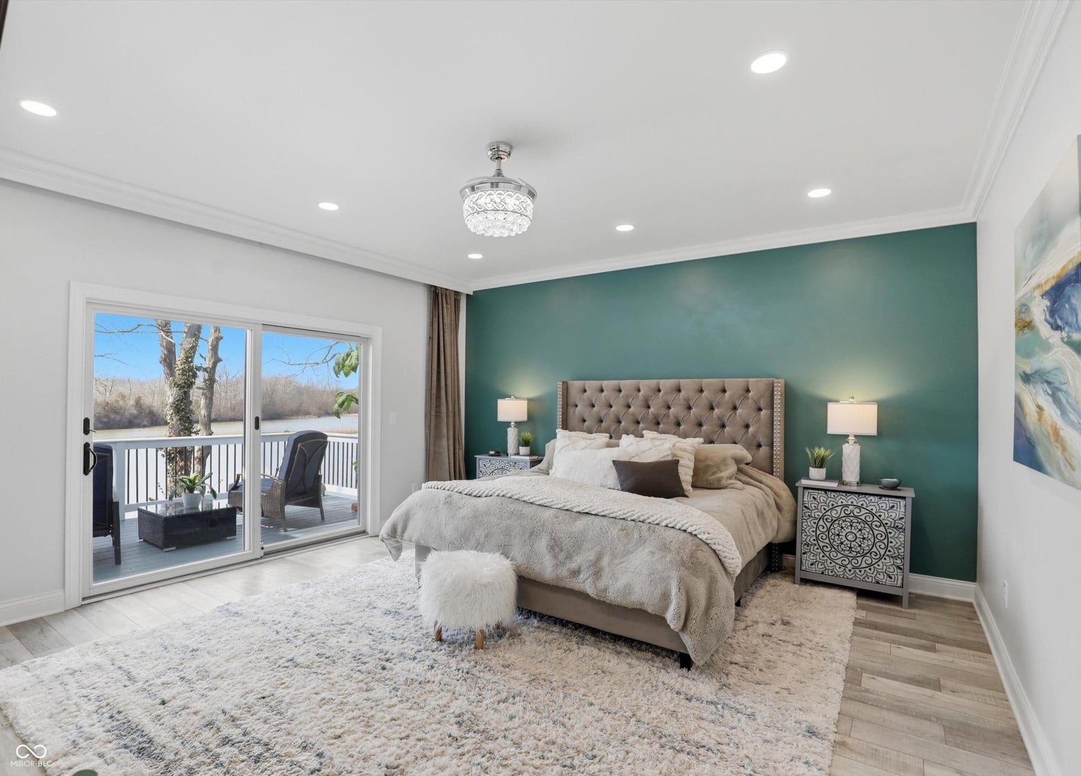 Luxurious primary suite with balcony and designer finishes.