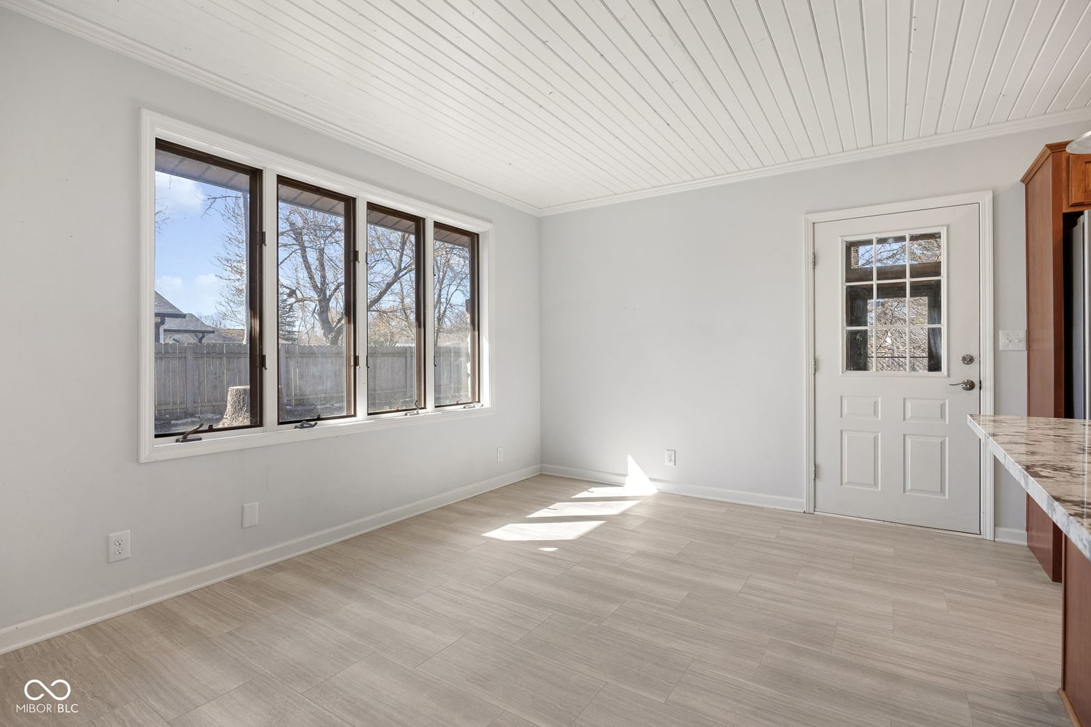 Bright dining space with abundant natural light and modern finishes.