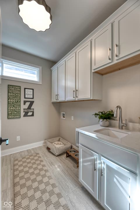 Laundry room at 5918 Maple Glen Drive, Noblesville, IN — Bright, contemporary laundry room with premium cabinetry.