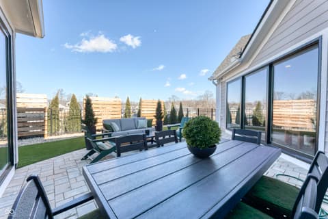 Outdoor living area at 5918 Maple Glen Drive, Noblesville, IN — Stunning rooftop deck with premium finishes and seating.