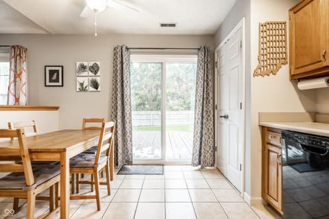 Dining room at 450 E Pine Ridge Drive, Westfield, IN — Bright dining area with direct deck access and yard views.