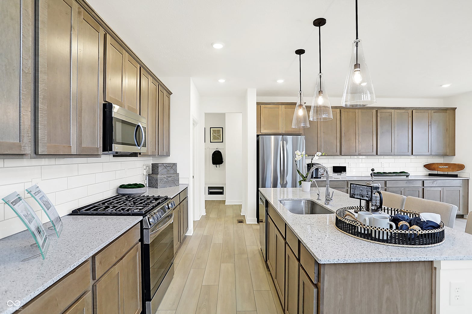 Modern kitchen with quartz counters and quality stainless appliances.