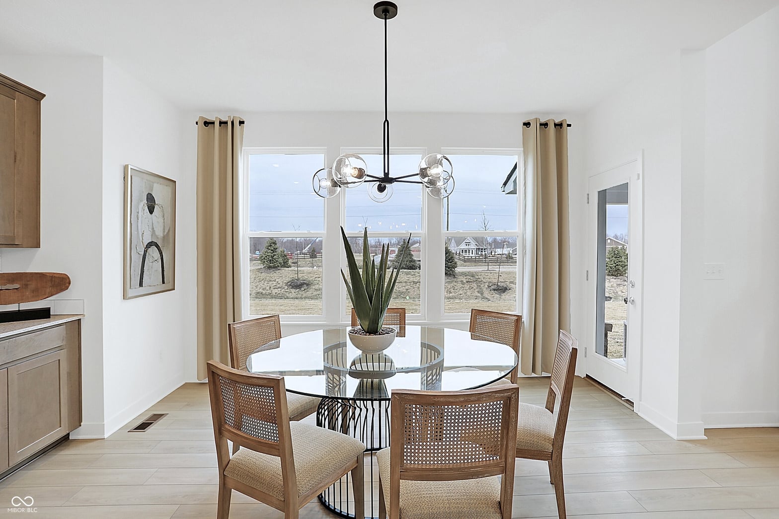 Bright dining area with sweeping countryside views and modern finishes.