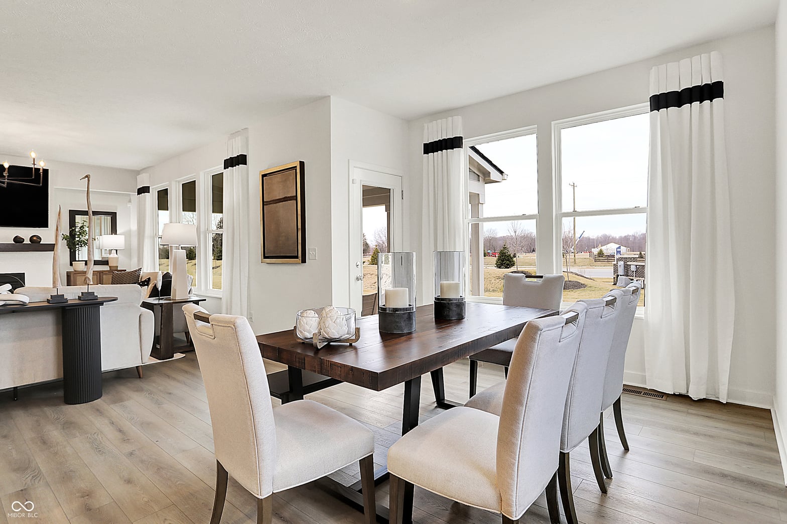 Bright open concept dining with expansive windows and views.