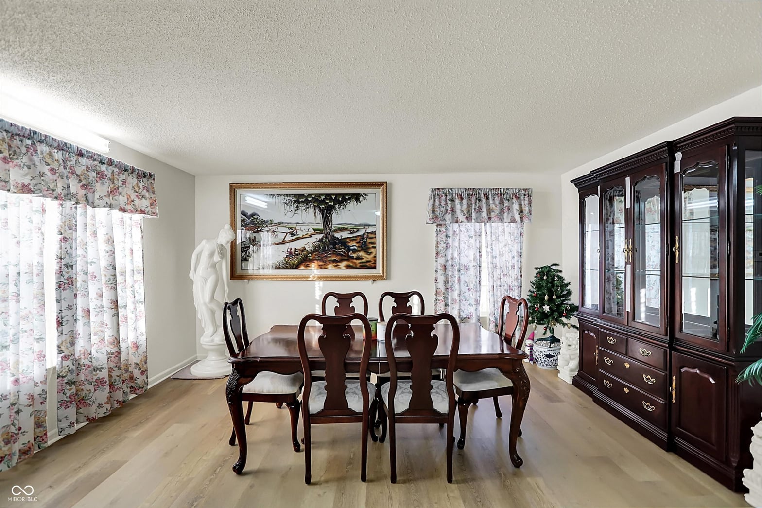 Elegant formal dining room with classic furnishings and natural light.
