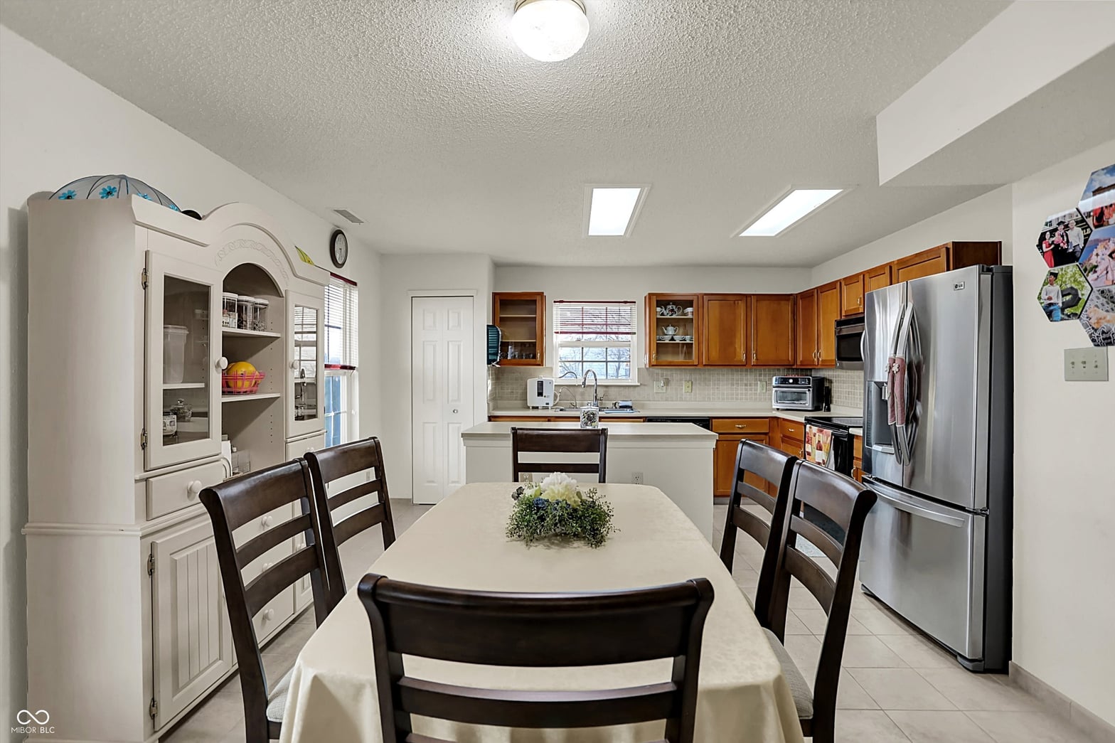 Bright kitchen with skylights and wood cabinetry.