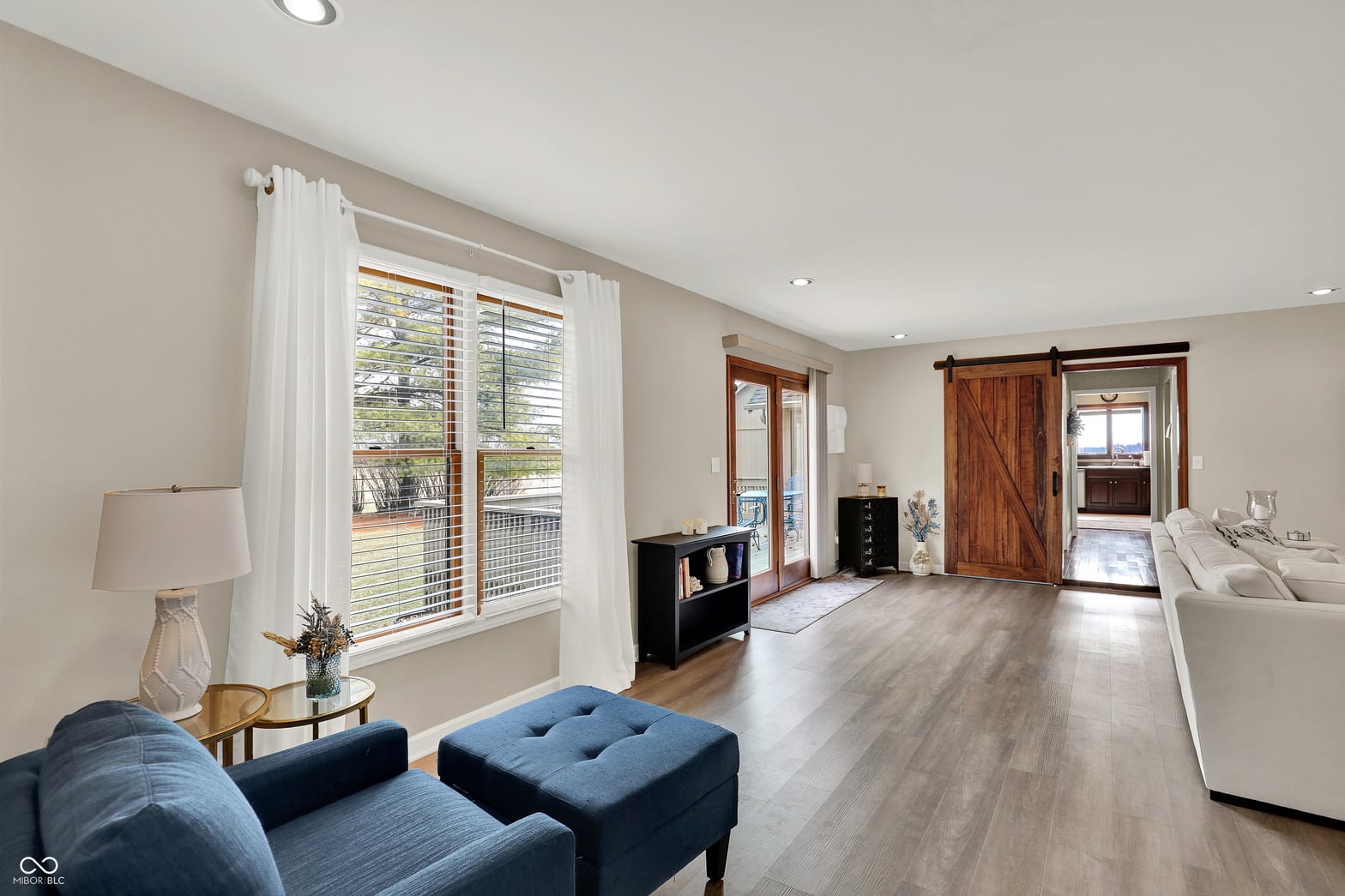 Spacious primary suite with deck access and modern finishes.