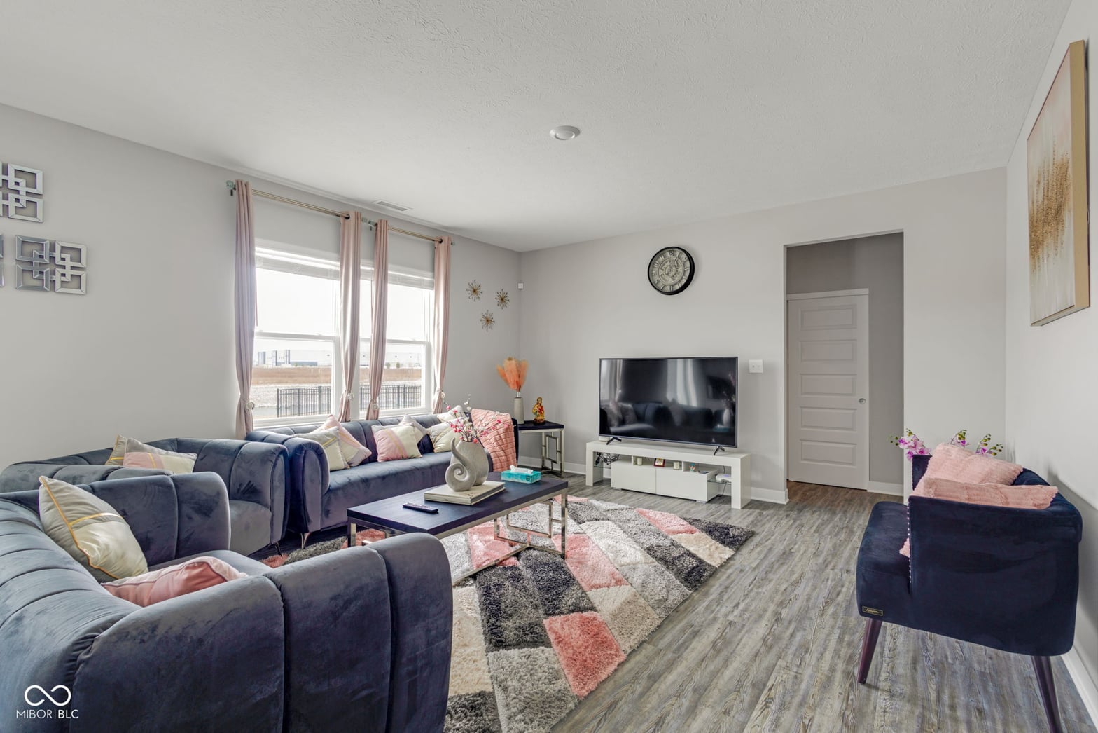 Bright, spacious living room with modern furnishings.