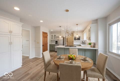 Kitchen at 72 Ashbourne Drive, Noblesville, IN — Bright modern kitchen with sage accents and open layout.