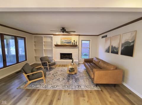 Living room at 72 Ashbourne Drive, Noblesville, IN — Spacious living room with fireplace and built-in shelving.
