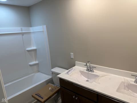 Primary bathroom at 1291 Stayview Road, Westfield, IN — Luxurious primary bath with marble double vanity.