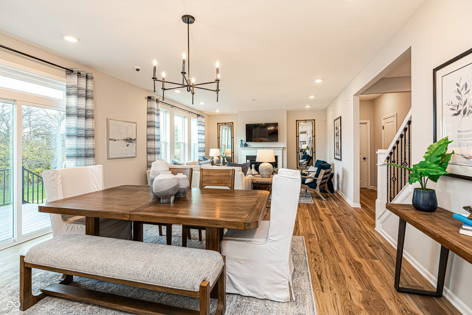 Spacious open-concept dining with hardwood floors and natural light.