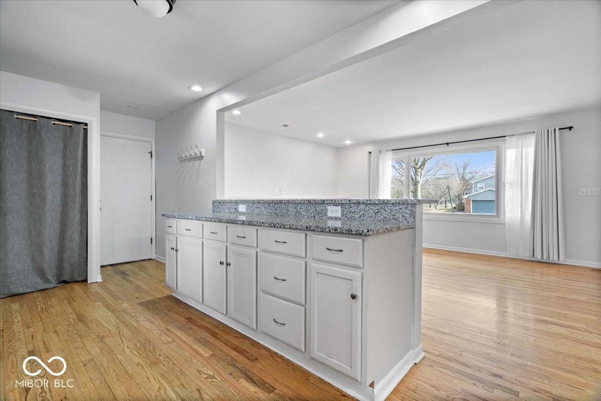 Spacious primary bath with granite counters and modern finishes.