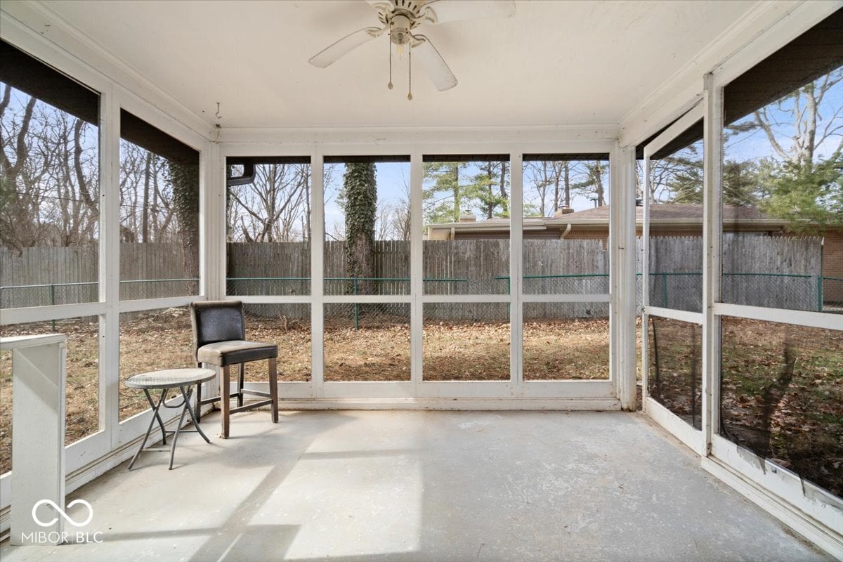 Spacious screened porch with expansive yard views.