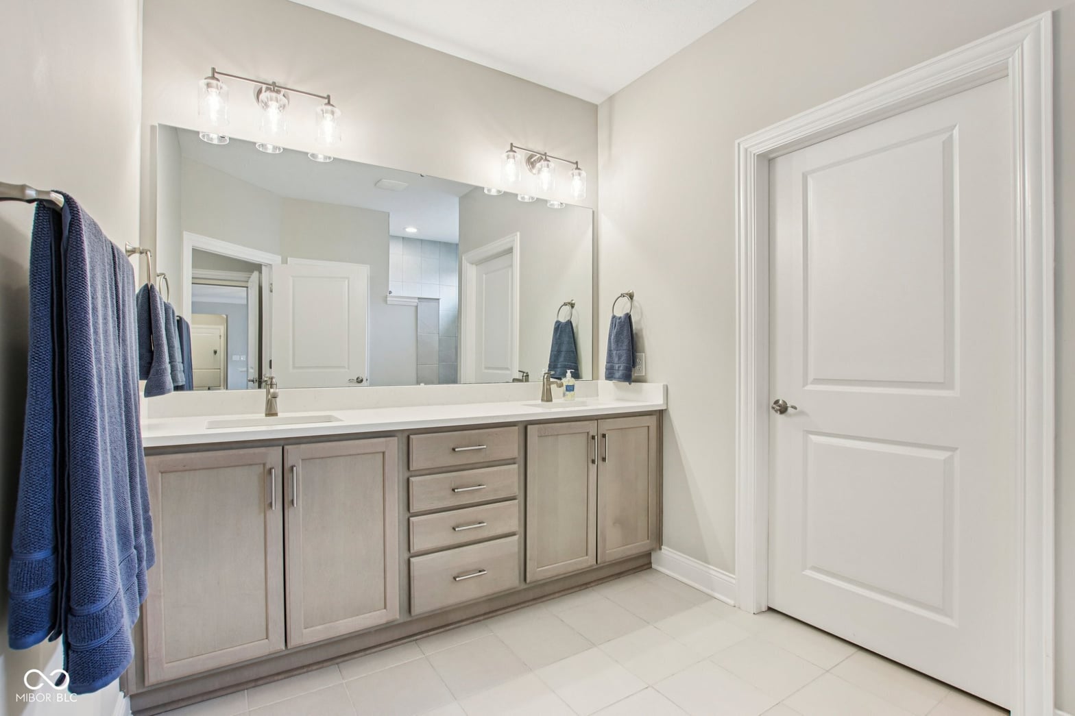 Elegant primary bath with spacious double vanity and modern finishes.