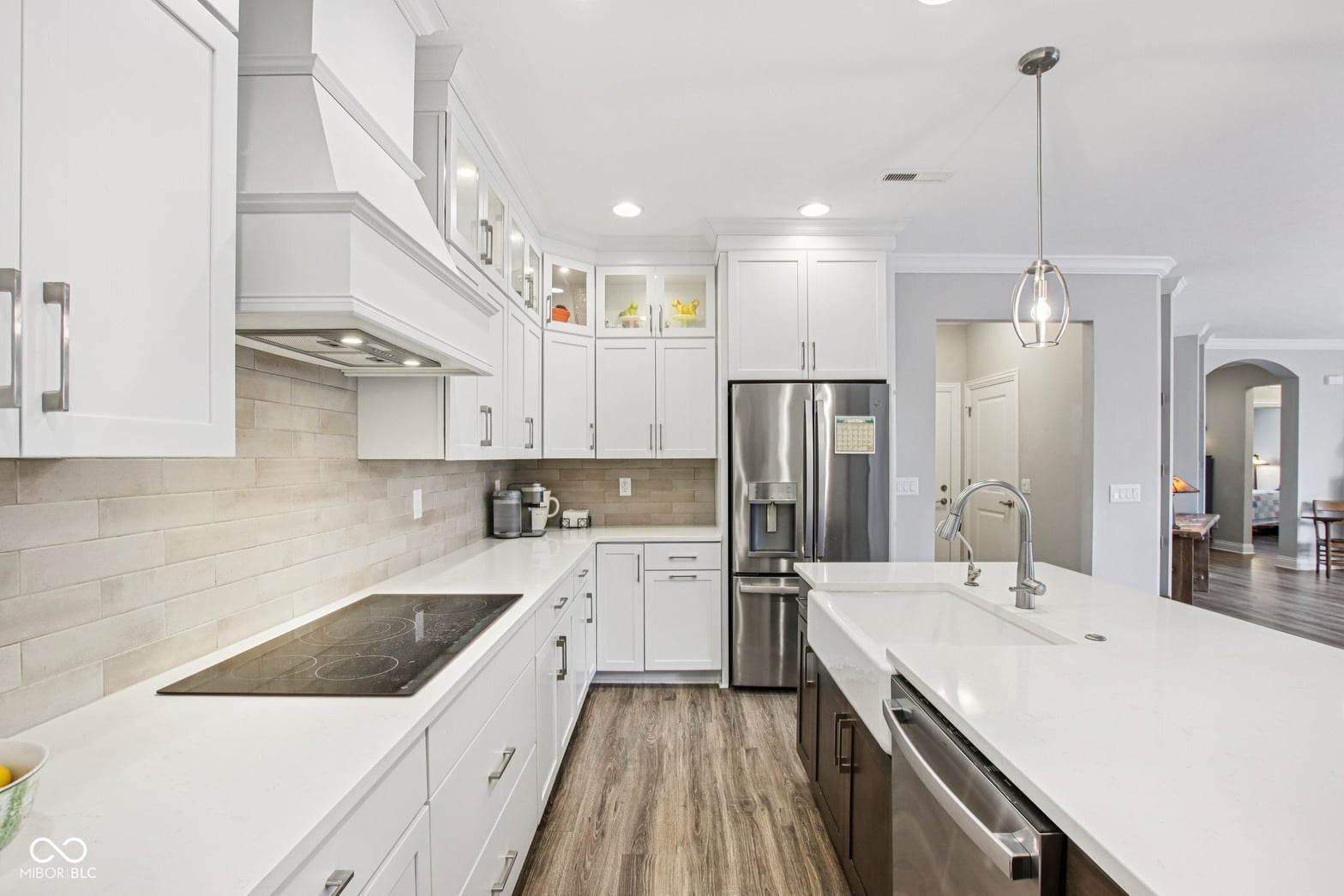 Bright modern kitchen with premium finishes and island.