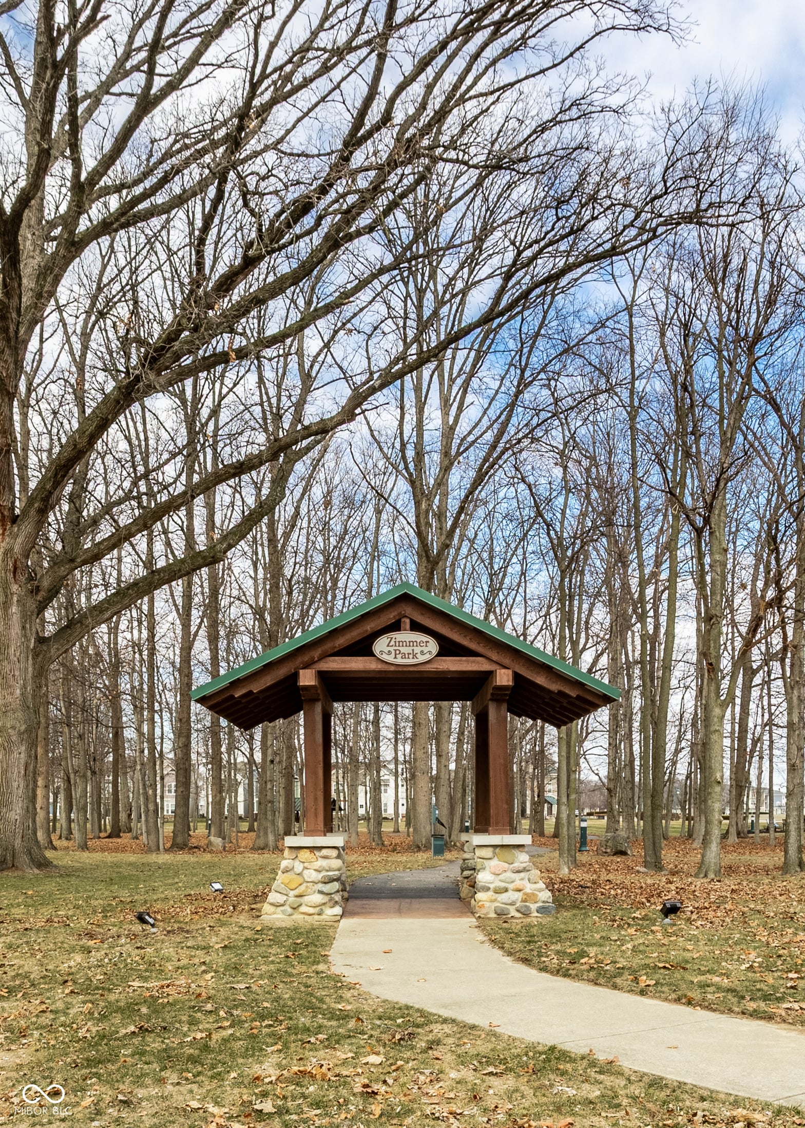 Classic gazebo nestled in mature wooded grounds.