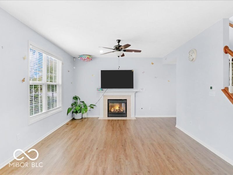 Bright family room with fireplace and modern updates.