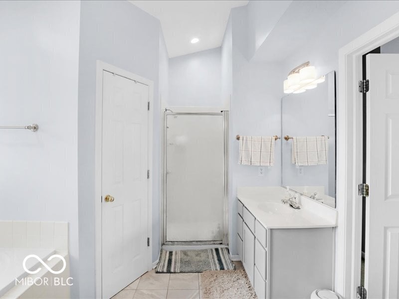 Bright, spacious primary bath with walk-in shower.
