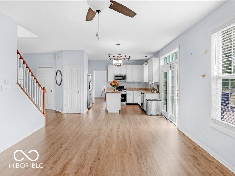 Bright open kitchen with island and patio access.