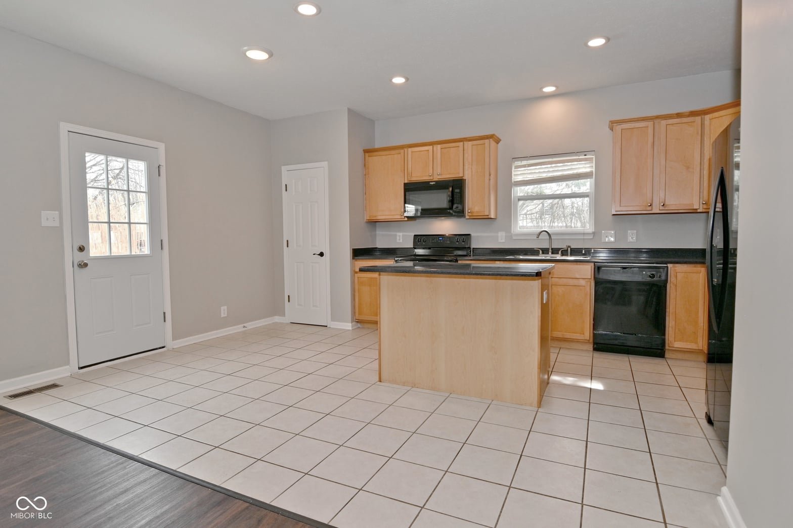 Spacious kitchen with island and natural light.