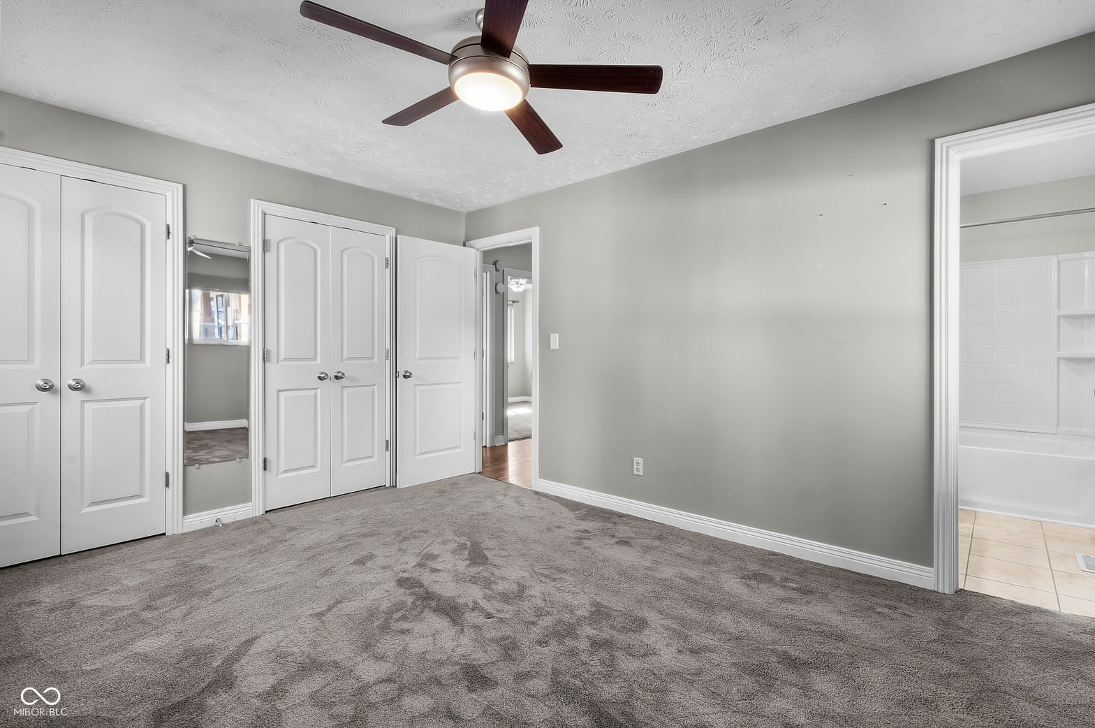 Spacious primary bedroom with walk-in closet and ensuite.