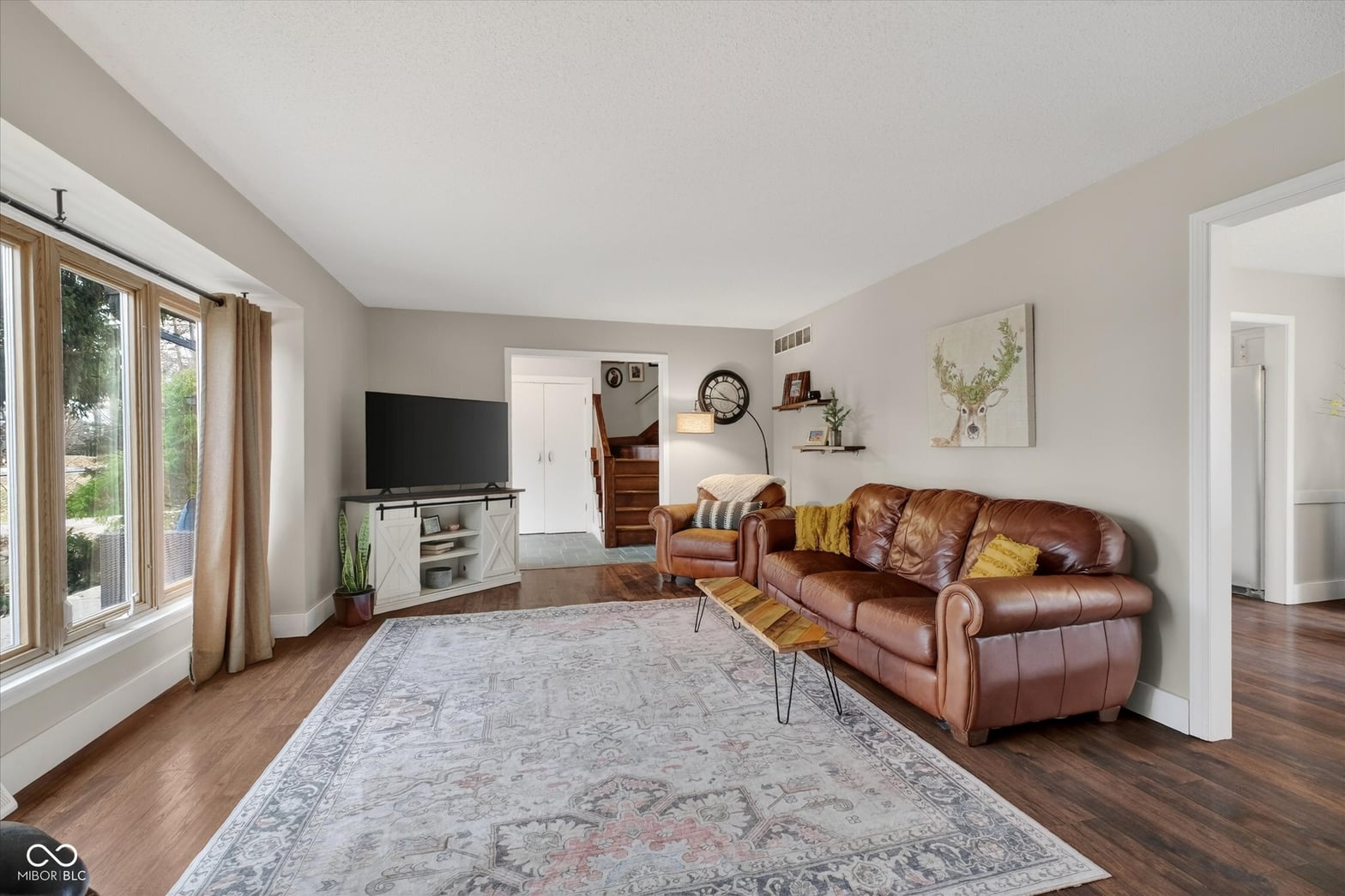 Bright living room with hardwood floors and modern updates.