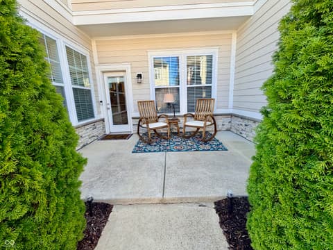 Outdoor living area at 13201 E 131st Street, Fishers, IN — Spacious covered patio with skylights and elegant seating.