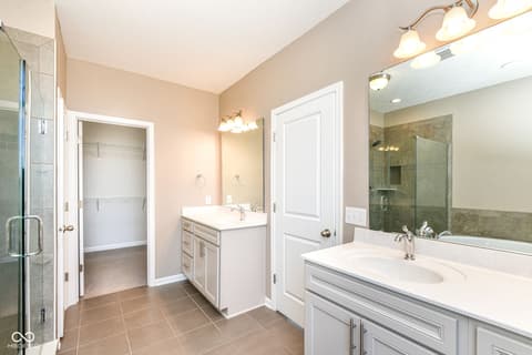 Primary bathroom at 13201 E 131st Street, Fishers, IN — Spacious primary bath with double vanity and shower.