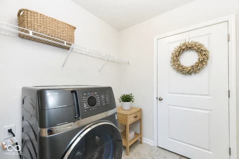 Laundry room at 13201 E 131st Street, Fishers, IN — Clean, organized laundry room with modern appliances.