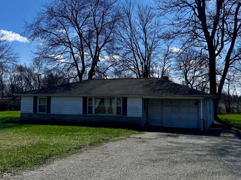 Front exterior at 3837 W State Road 32, Westfield, IN — Spacious ranch home on wooded lot with garage.