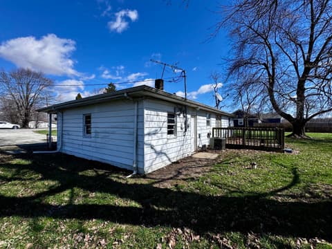 Front exterior at 3837 W State Road 32, Westfield, IN — Single-story home with deck on spacious rural lot.