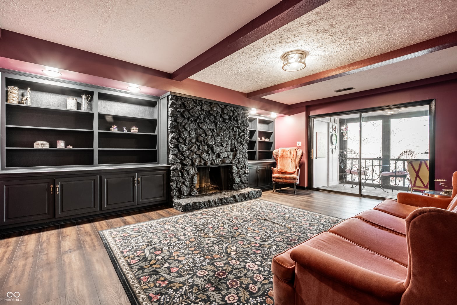 Elegant living room with fireplace and built-in cabinetry.