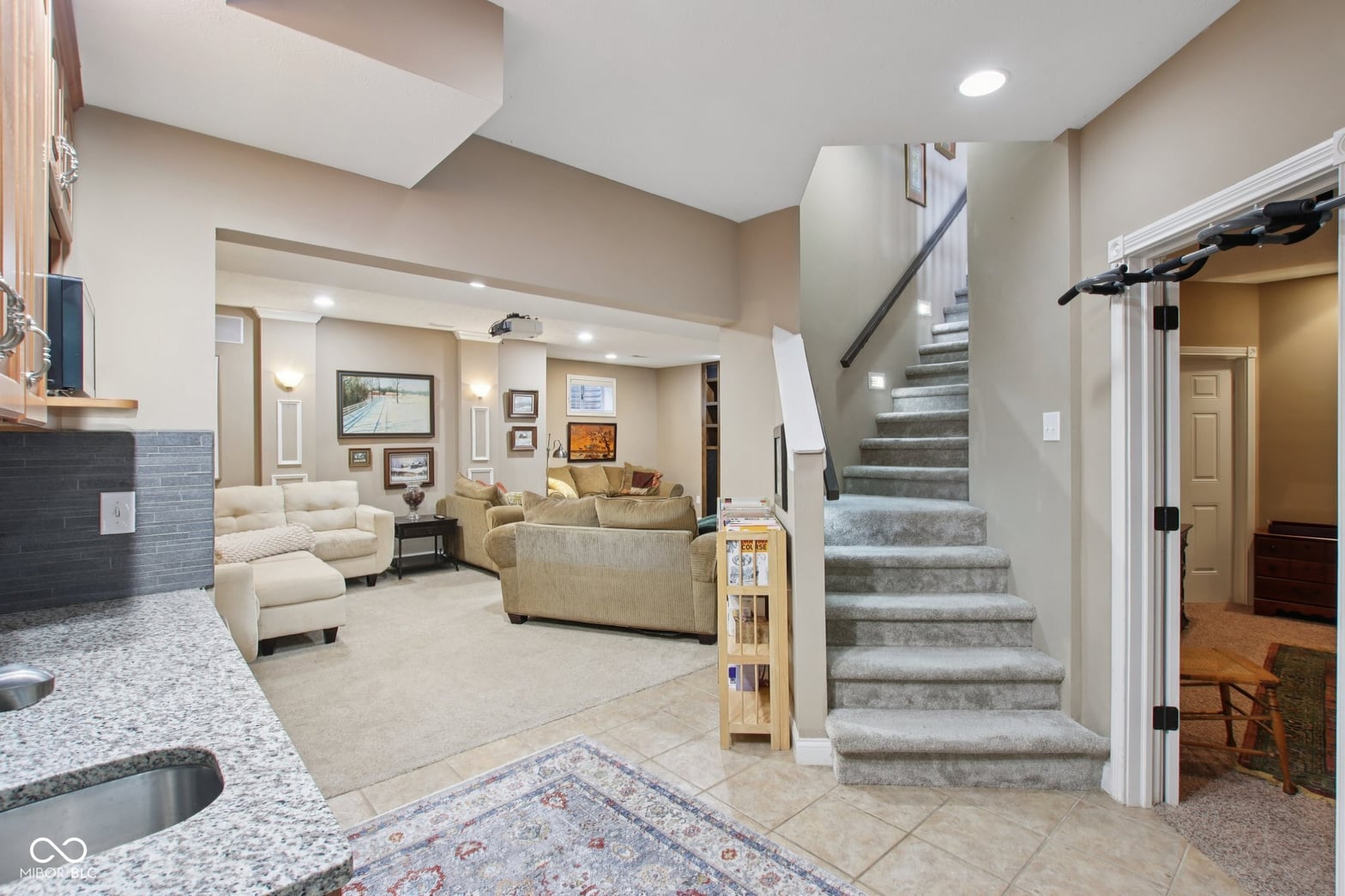 Spacious open-concept living with vaulted ceilings and modern finishes.