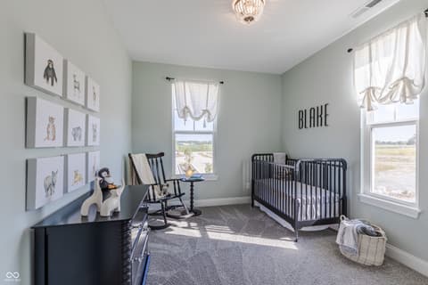 Primary bedroom at 15732 Showdown Road, Noblesville, IN — Bright nursery with pastoral views and modern finishes.