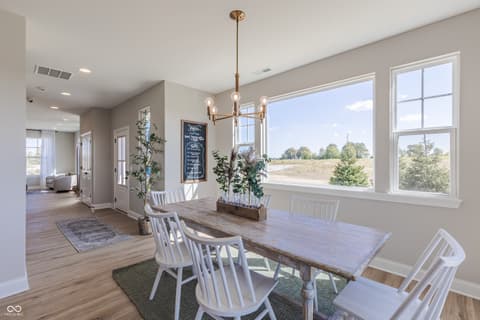Dining room at 15732 Showdown Road, Noblesville, IN — Bright dining room with expansive countryside views.