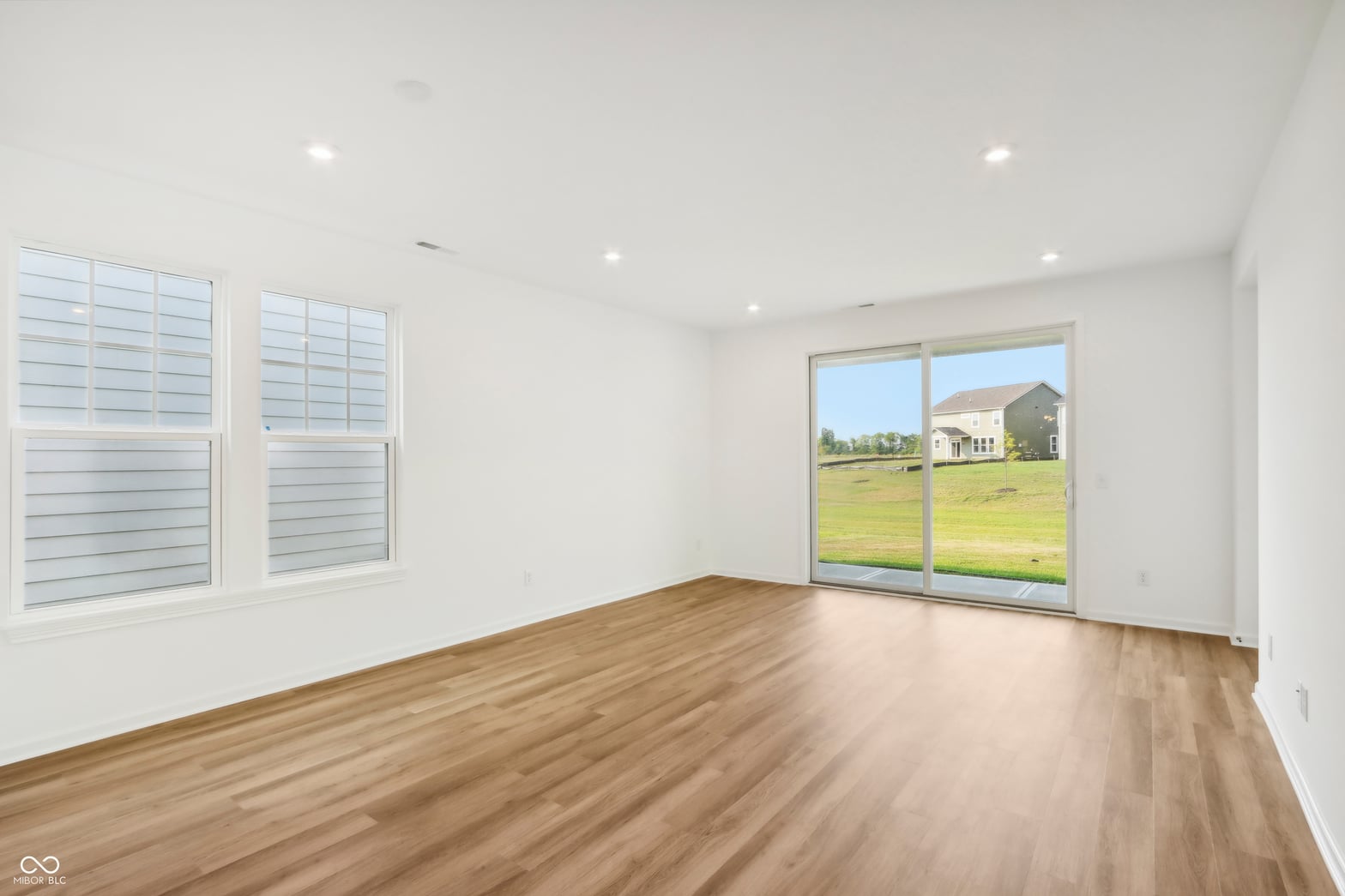 Family room at 15742 Showdown Road, Noblesville, IN — Bright modern family room with expansive rural views.