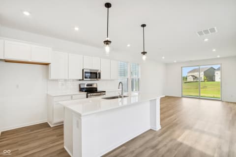 Kitchen at 15742 Showdown Road, Noblesville, IN — Bright modern kitchen with large island and yard views.
