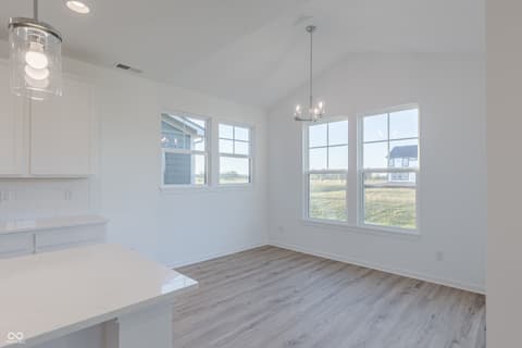 Dining room at 15752 Showdown Road, Noblesville, IN — Bright modern dining area with expansive rural views.