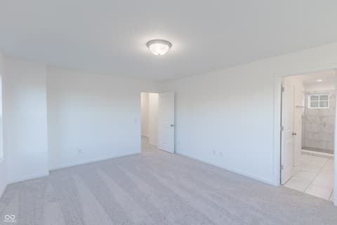 Primary bedroom at 15752 Showdown Road, Noblesville, IN — Spacious primary bedroom with ensuite bathroom access.