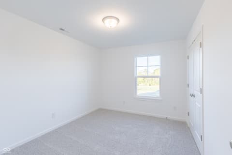 Bedroom at 15752 Showdown Road, Noblesville, IN — Bright bedroom with large window and fresh finishes.